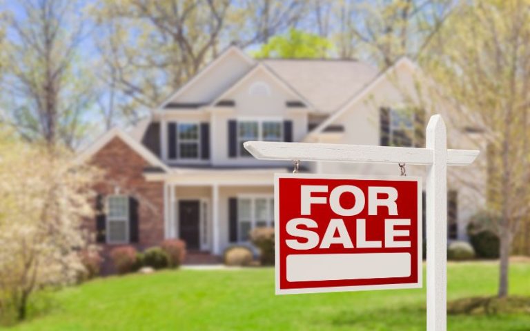 For sale sign in front of a house