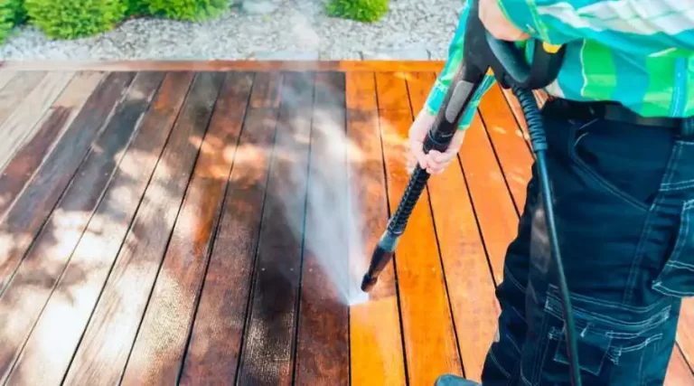 Power washing a wooden deck