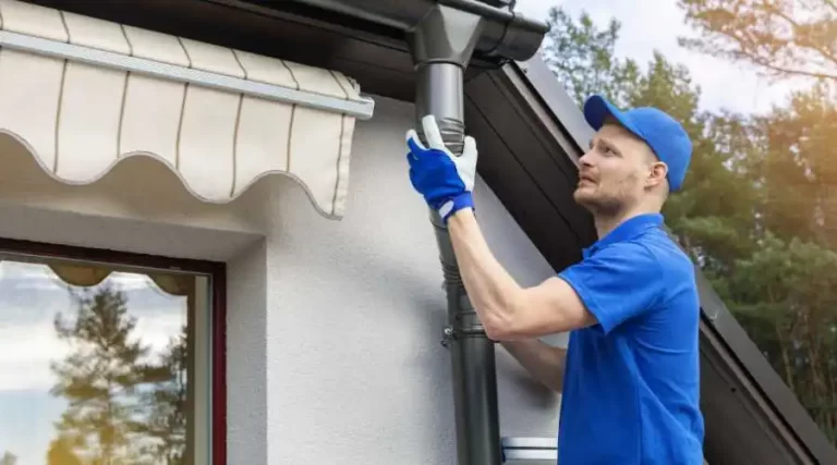 Gutter attaching a down spout to roof